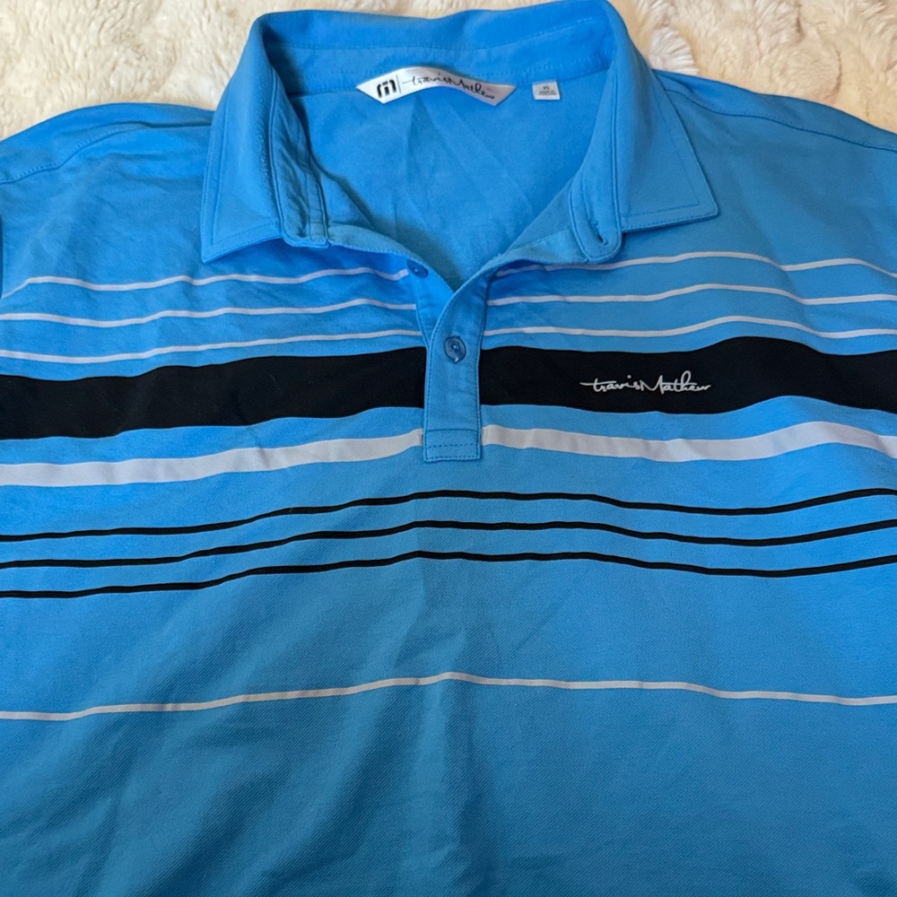 Travis Mathew Blue Striped Polo with Black Accents